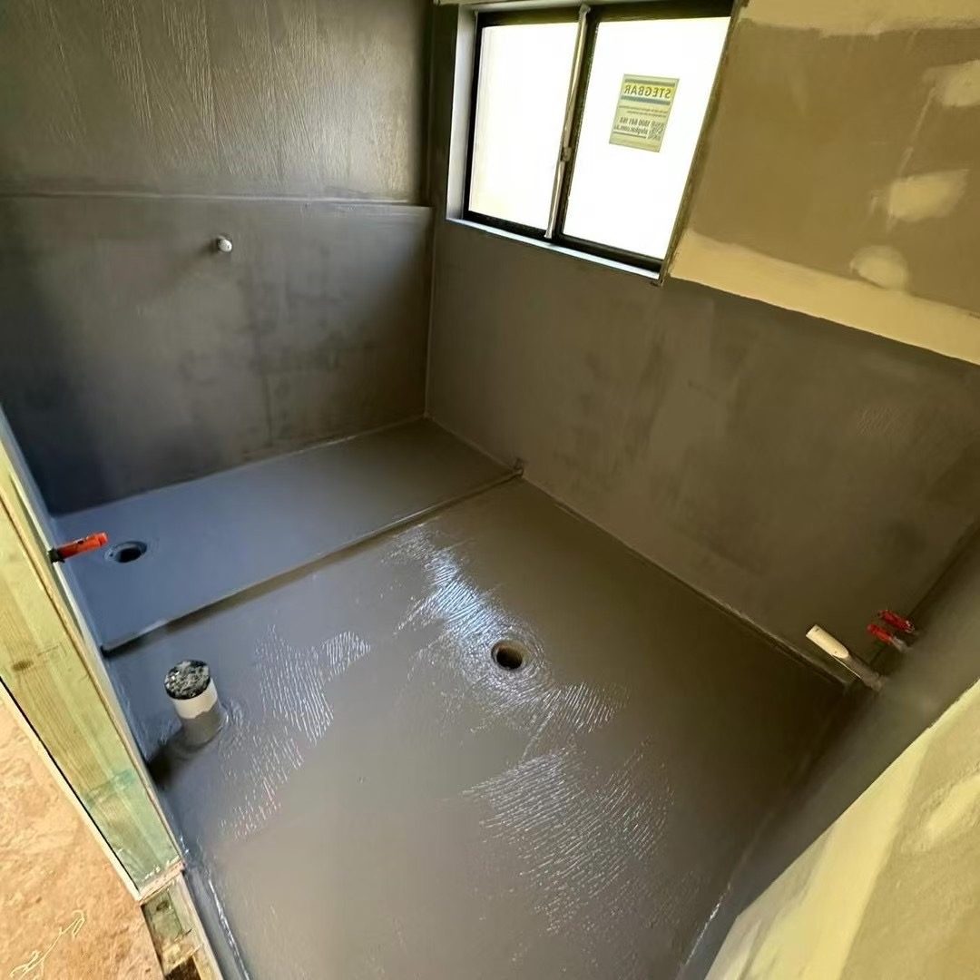 Waterproof membrane applied to bathroom walls and floor